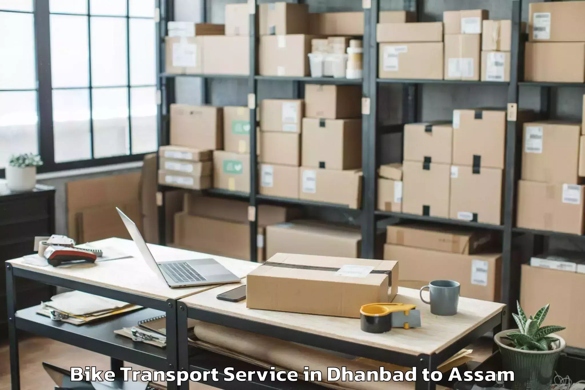 Reliable Dhanbad to Naharkatia Bike Transport